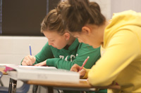 Students working in math classroom