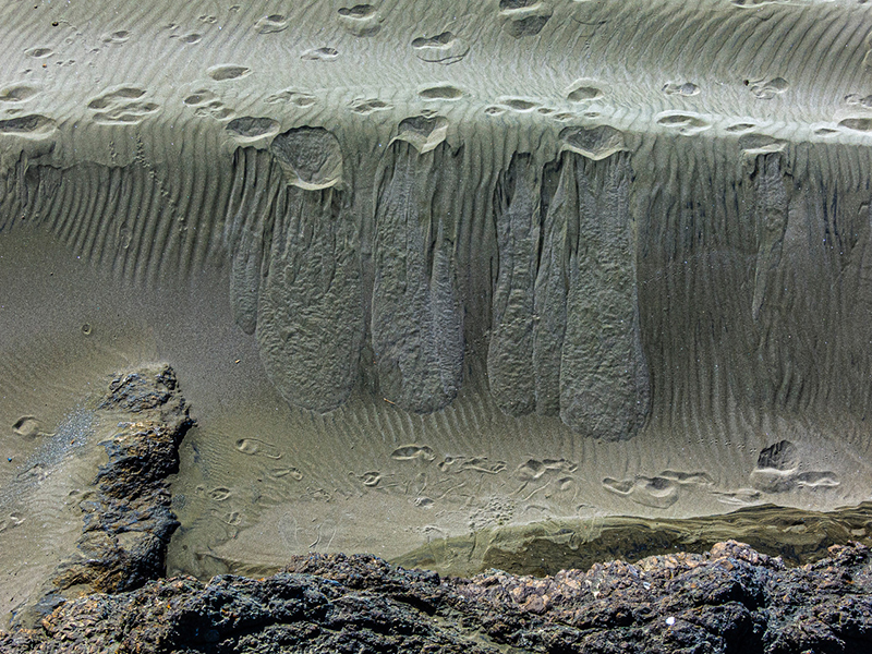 Looking down on lines and impressions in the sand