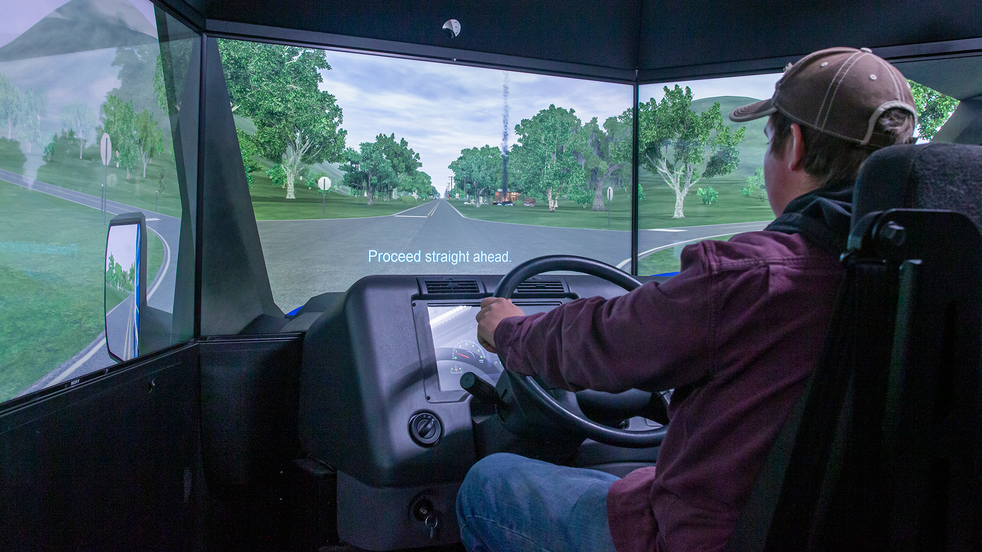 Young man in a CDL simulator